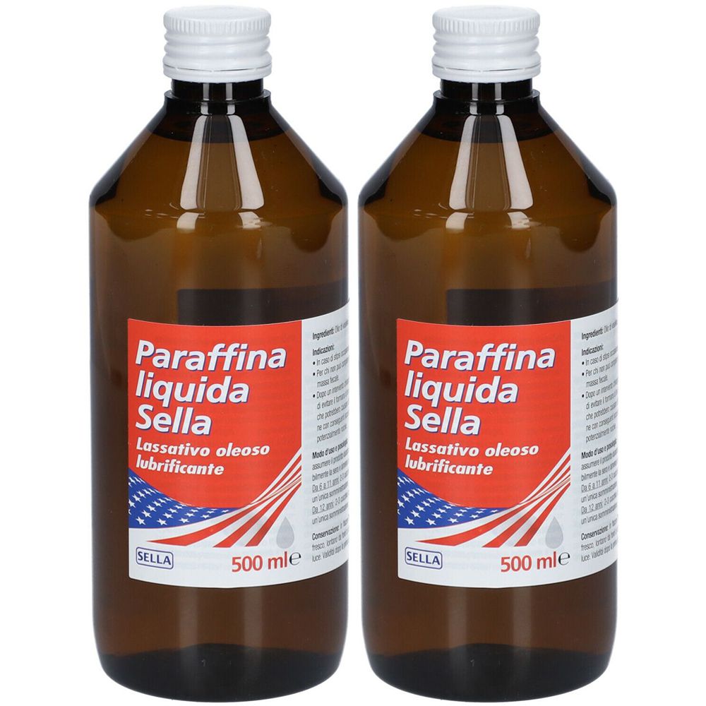 Due flaconi marroni con tappi bianchi. L'etichetta riporta "Paraffina liquida Sella".