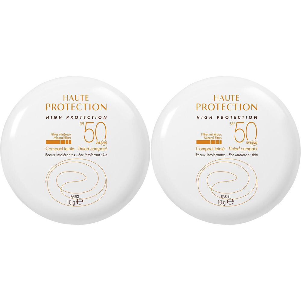 Due compatti solari bianchi rotondi. Scritta dorata: HAUTE PROTECTION, SPF 50, Compact teinté. Per pelli intolleranti.
