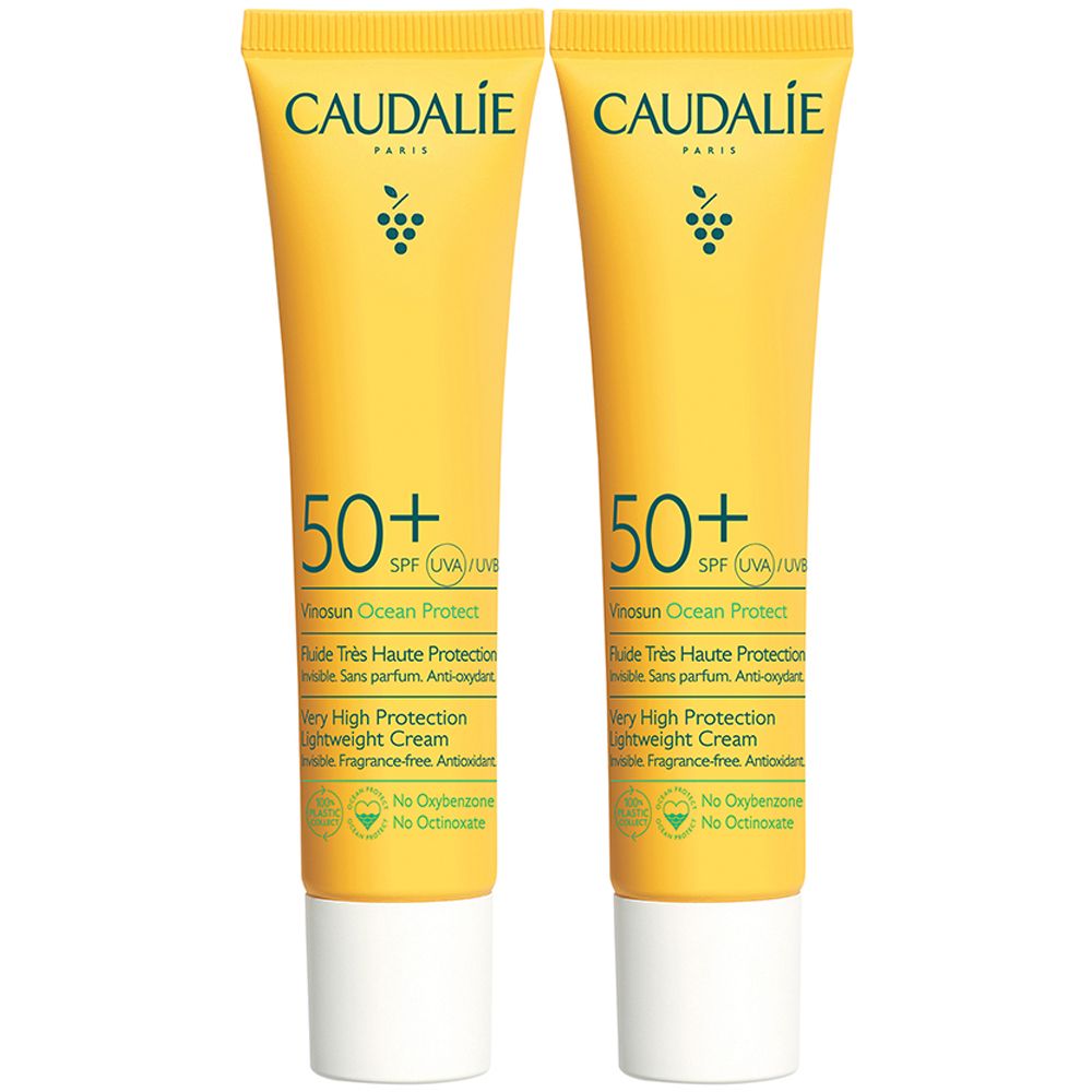 Due tubi gialli con tappi bianchi. Ogni tubo riporta "CAUDALIE" e "50+".