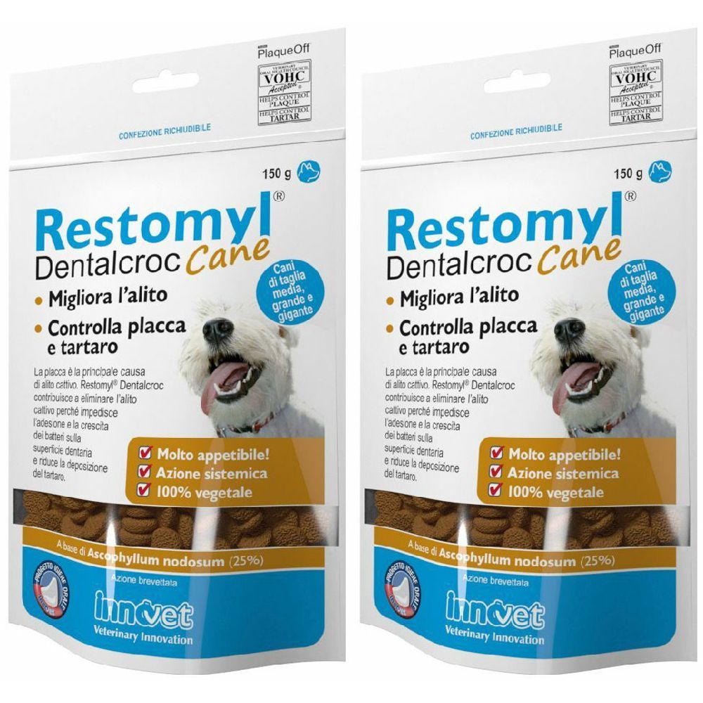 Due confezioni di Restomyl Dentalcroc Cane. Scritte: Migliora l'alito, Controlla placca e tartaro. Con cane sulla confezione.