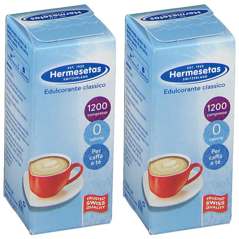 Due confezioni di Hermesetas Edulcorante Classico. Confezione azzurra con logo, testo e immagine di tazza di caffè. 1200 compresse, 0 calorie.