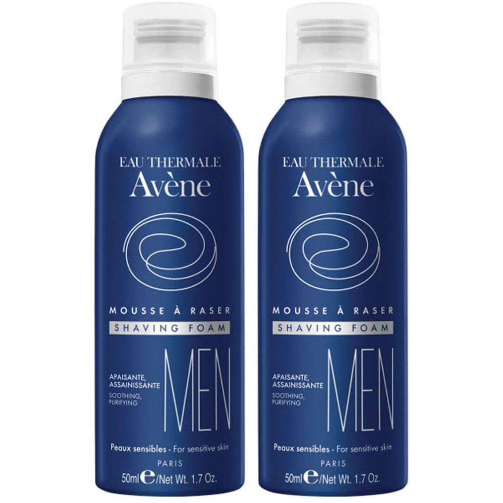 Due flaconi blu di schiuma da barba. Scritta: Eau Thermale Avène, Mousse à raser, Men. Per pelli sensibili. 50ml.