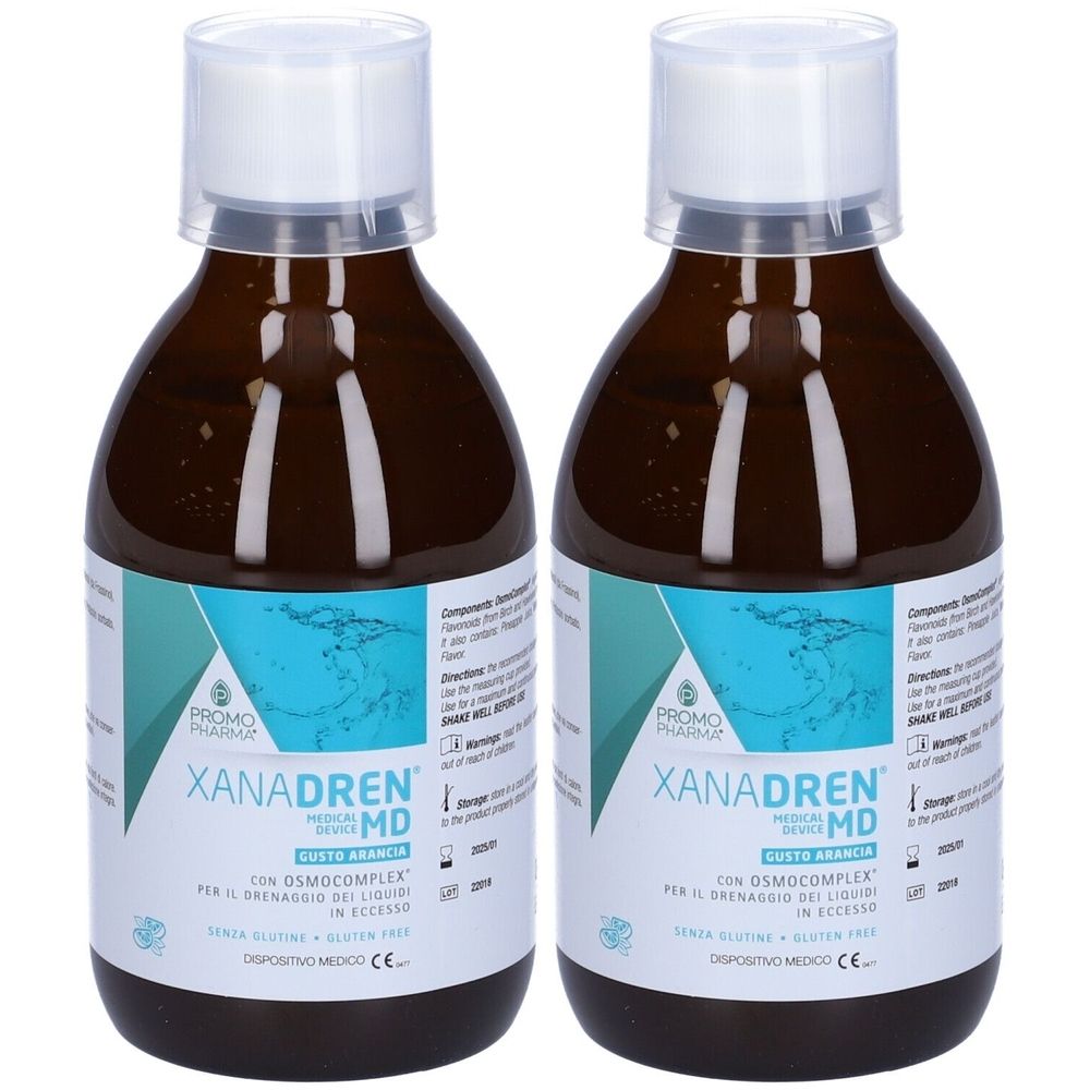 Due bottiglie di liquido marrone. Le etichette riportano "XANADREN MD" e "GUSTO ARANCIA".