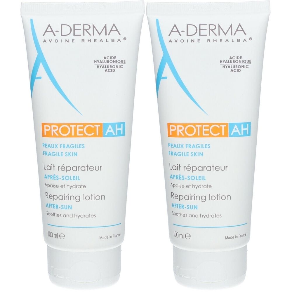 Due tubi di latte riparatore doposole A-DERMA PROTECT AH. Tubi bianchi con scritte blu e arancioni.
