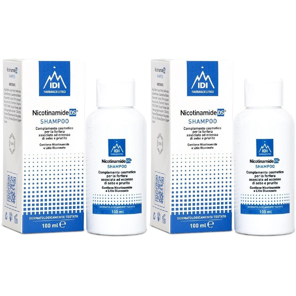 Due flaconi bianchi e due scatole con la scritta "Nicotinamide DS Shampoo". Il marchio è IDI Farmaceutici.