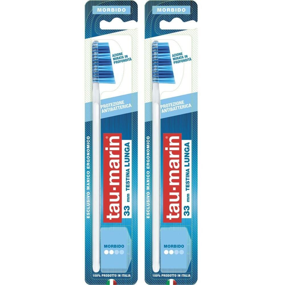Due spazzolini Tau-Marin in confezione doppia. Manico bianco, setole blu. "MorbidO" e "33mm Testina Lunga" visibili sulla confezione.
