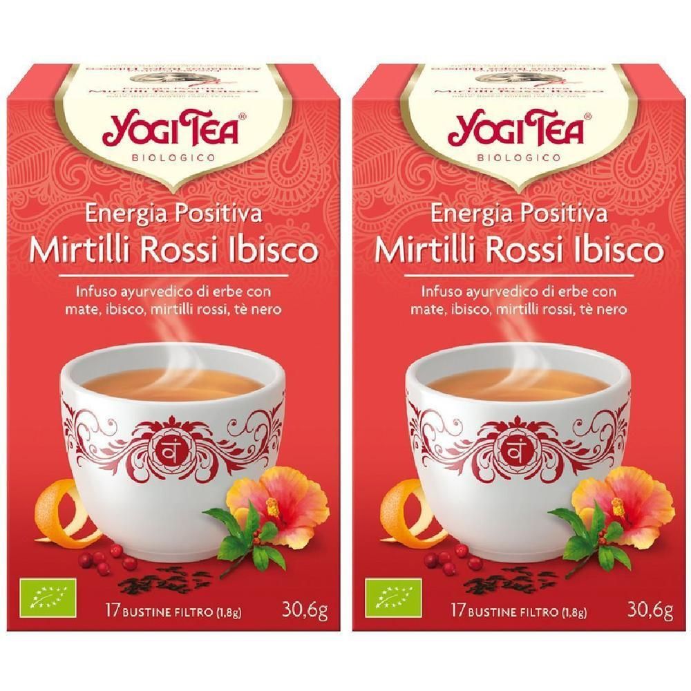 Due confezioni di Yogi Tea "Energia Positiva Mirtilli Rossi Ibisco" con 17 bustine ciascuna. Raffigurata una tazza di tè con ibisco e mirtilli rossi.