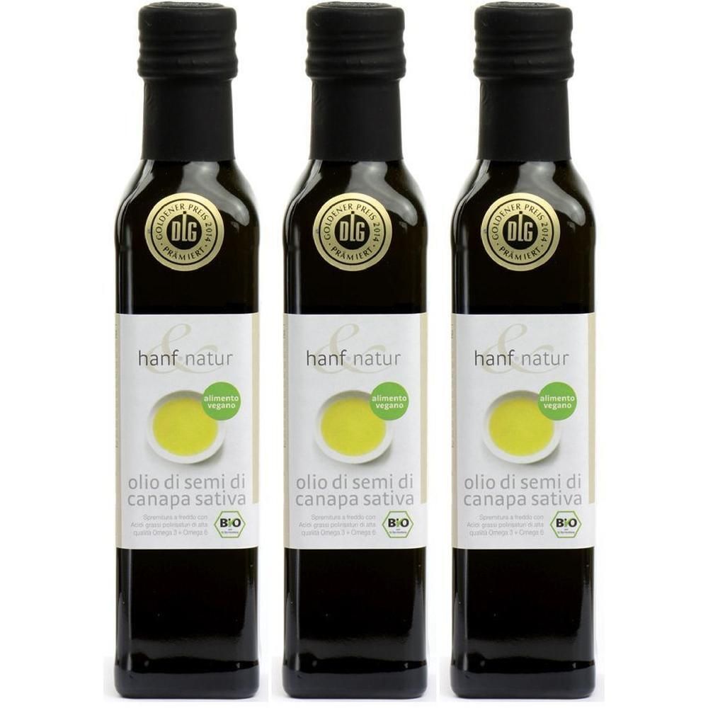 Tre bottiglie di olio di semi di canapa biologico con tappo nero.