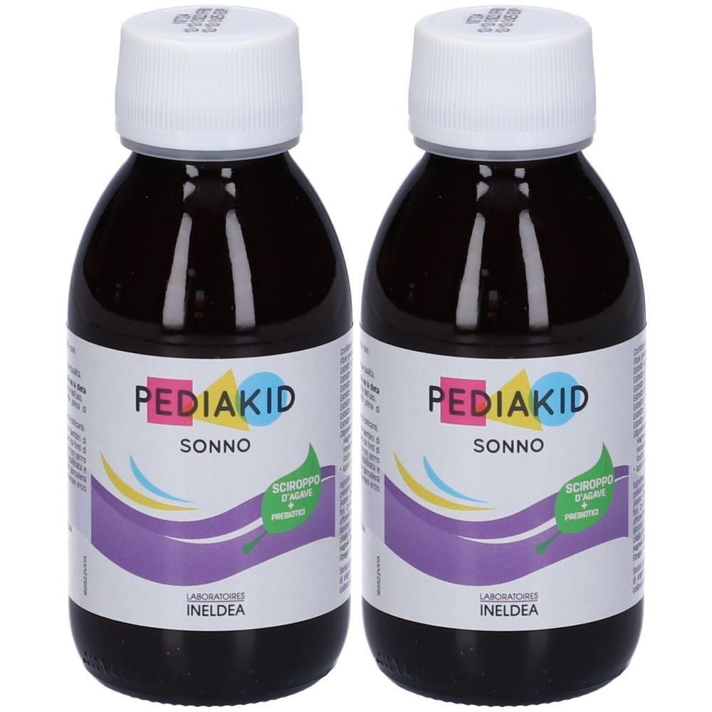 Due flaconi di Pediakid Sonno sciroppo con tappi bianchi. Liquido scuro all'interno.