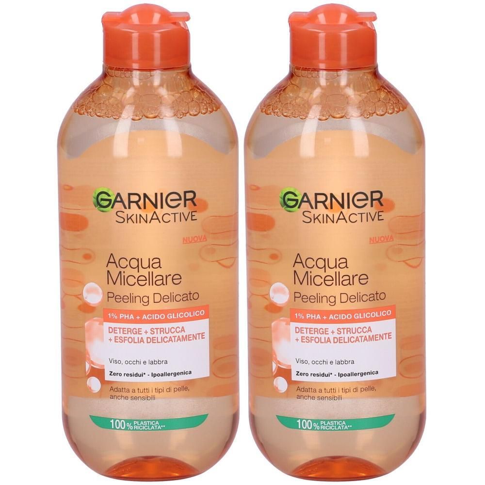 Due flaconi Garnier Skinactive Acqua Micellare Peeling Delicato con tappi arancioni.
