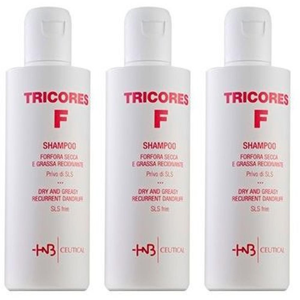 Tre flaconi bianchi di shampoo Tricores F per forfora secca e grassa ricorrente, senza SLS.
