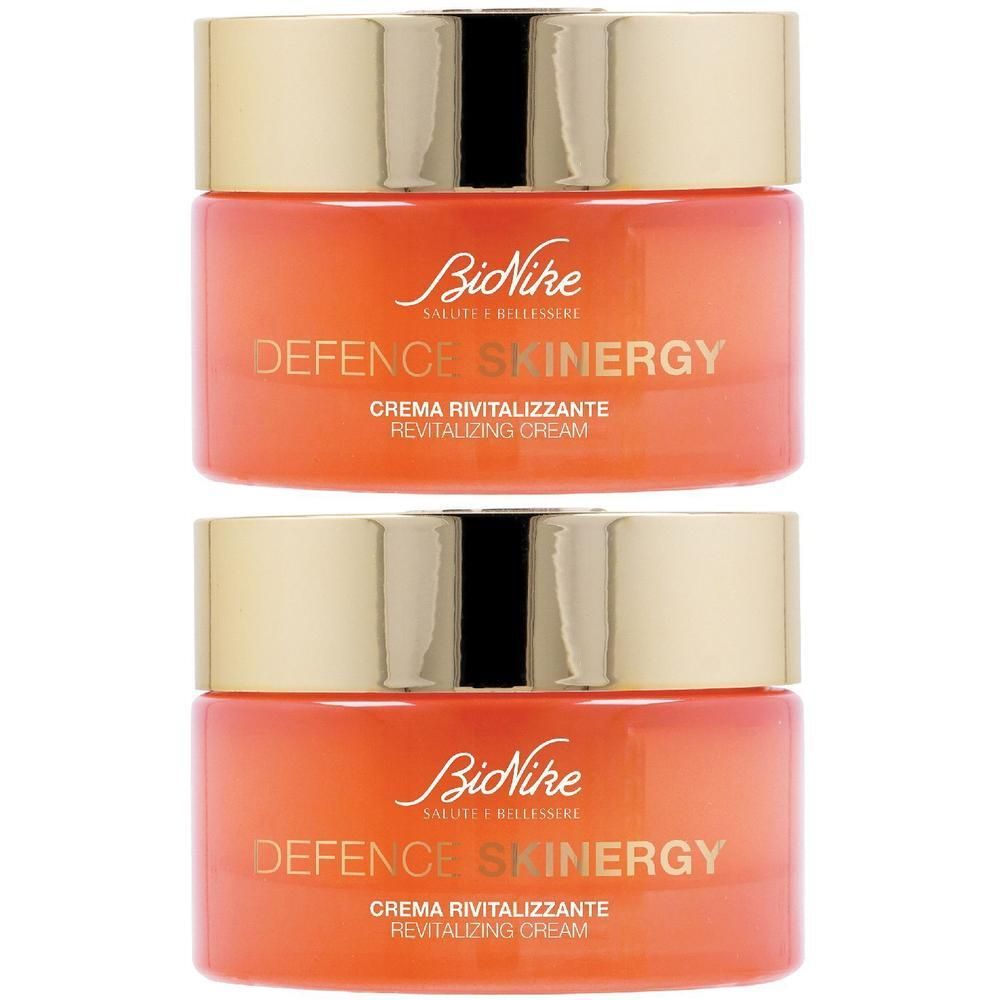 Due vasetti di crema rivitalizzante BioNike Defence Skinergy con tappi dorati.