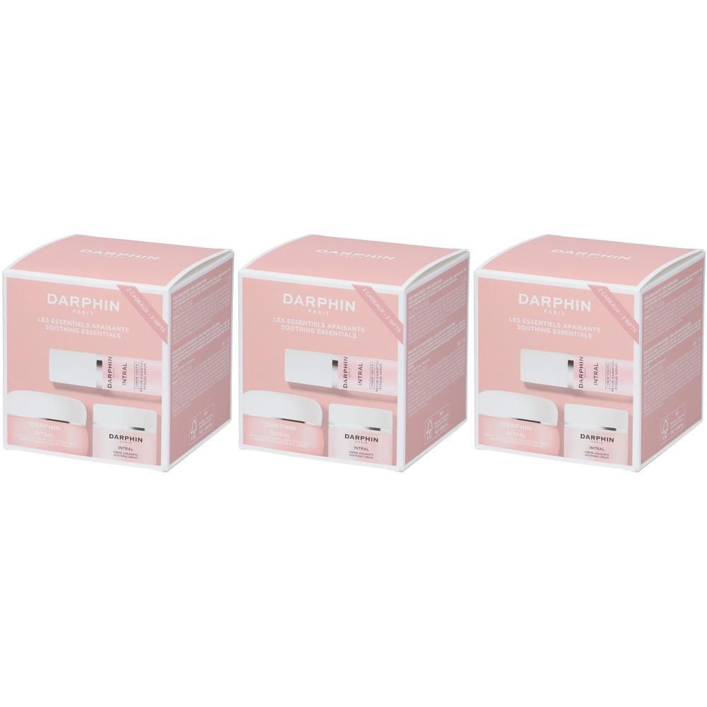 Tre cofanetti regalo Darphin, ognuno con una crema e un siero, in confezione rosa.