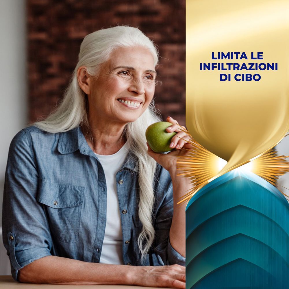 Donna anziana sorridente con occhiali tiene una mela. Testo sulla limitazione delle infiltrazioni di cibo.
