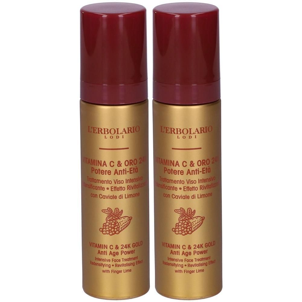 Due flaconi dorati con tappo rosso, L'Erbolario Trattamento Viso Vitamina C & Oro 24K.