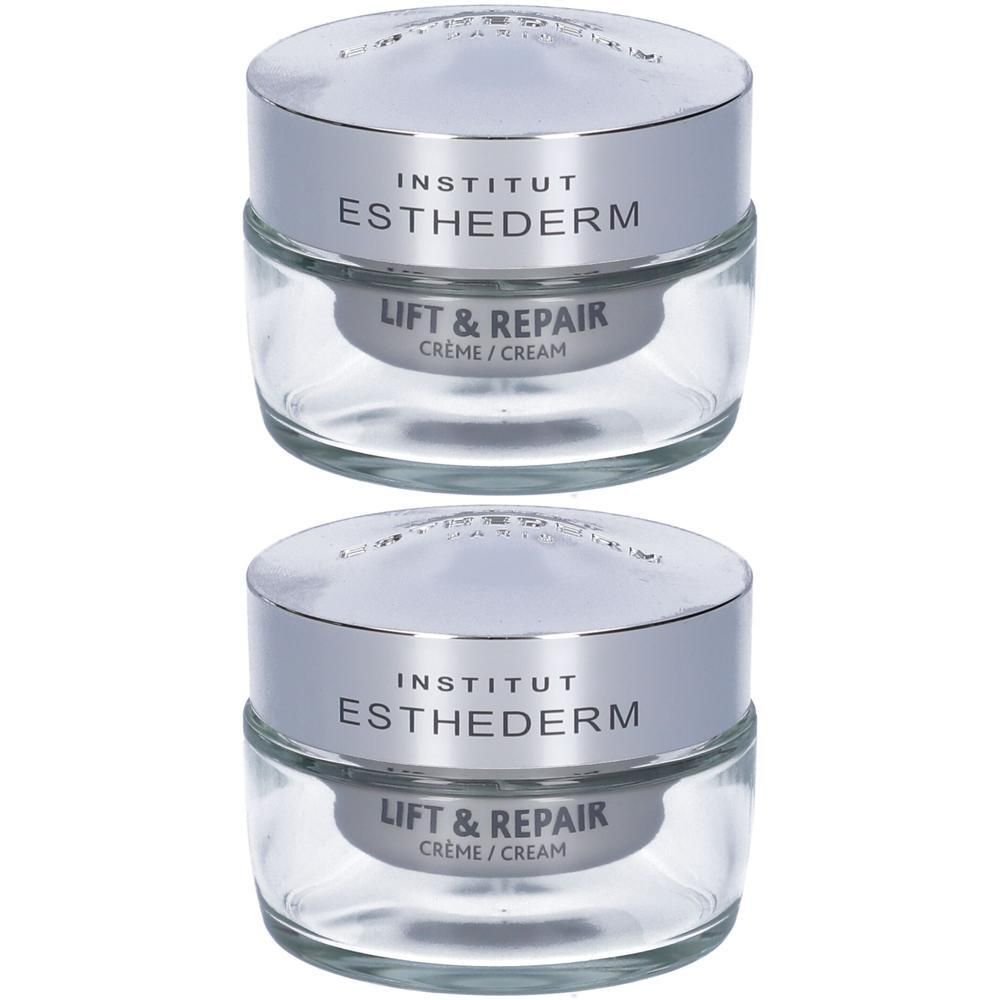 Due vasetti in vetro con tappi argentati, etichettati Institut Esthederm Lift & Repair Crema.