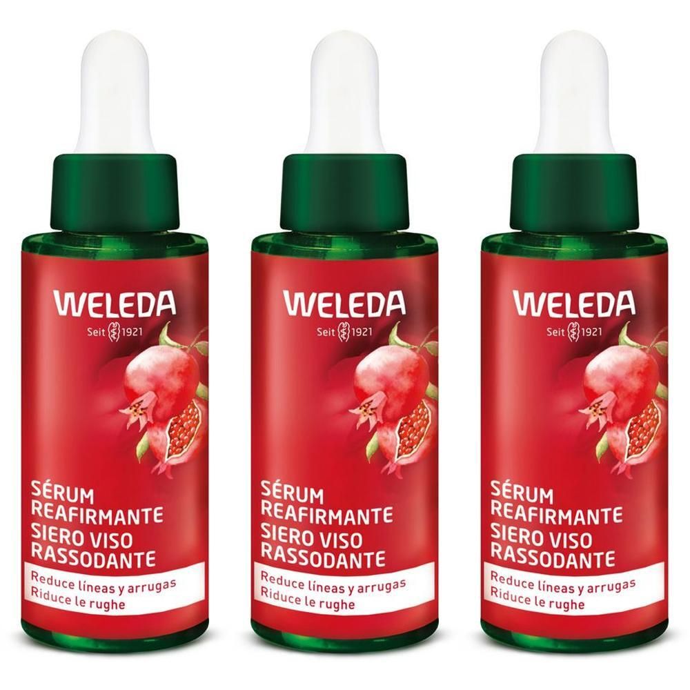 Tre flaconi di WELEDA Siero Viso Rassodante con motivo melograno.