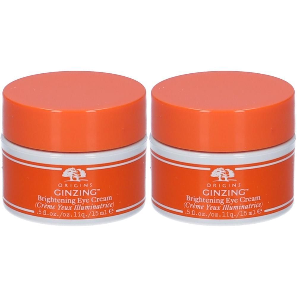 Due barattoli di crema contorno occhi Origins Ginzing™ con tappi arancioni ed etichette bianche.
