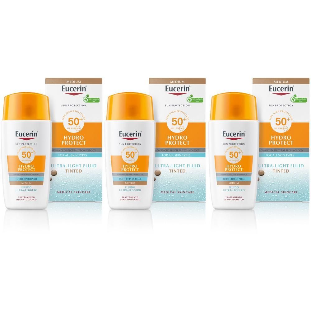 Tre flaconi di fluido colorato Eucerin Hydro Protect SPF 50, tonalità media.