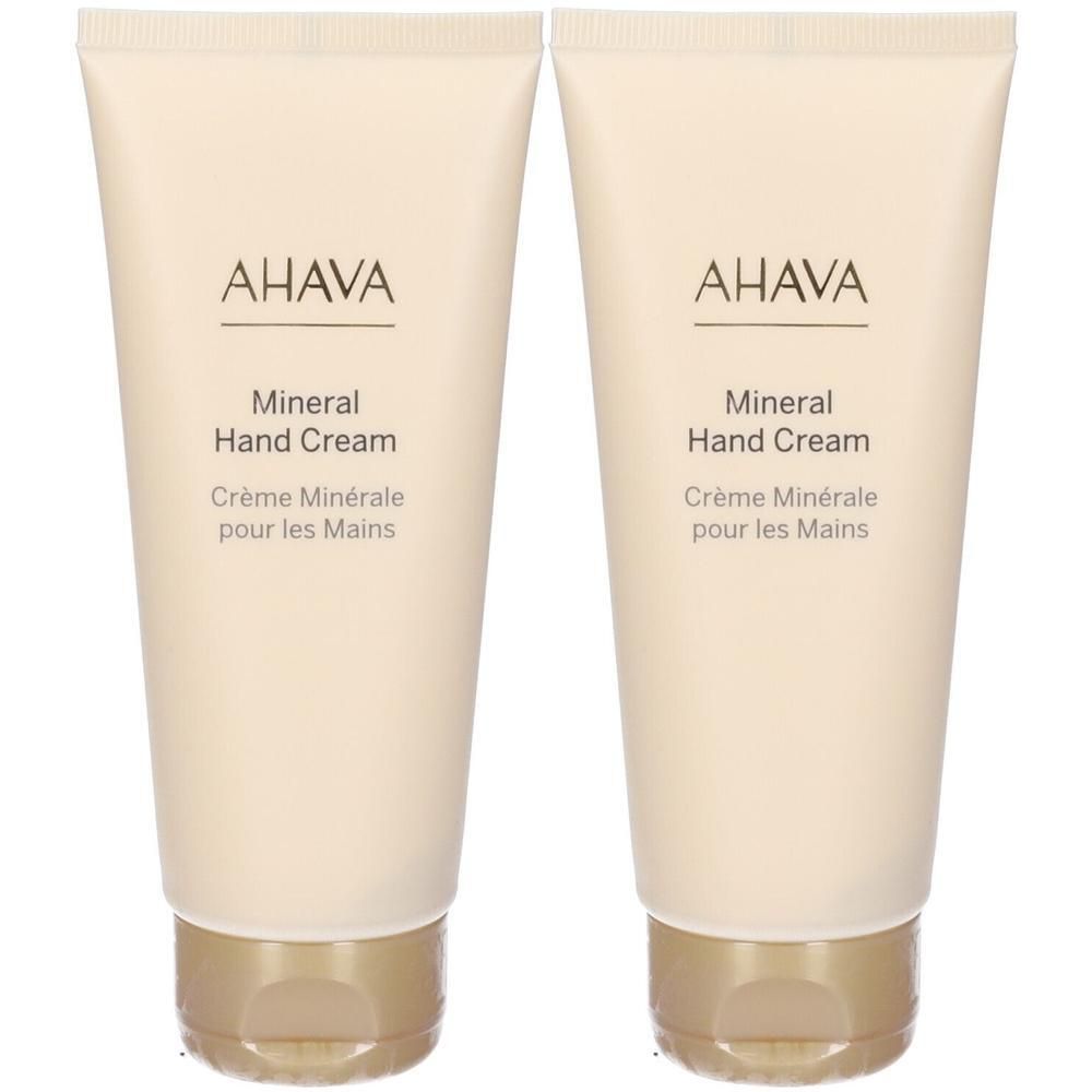 Due tubetti di AHAVA Crema Minerale per le Mani con tappi dorati.