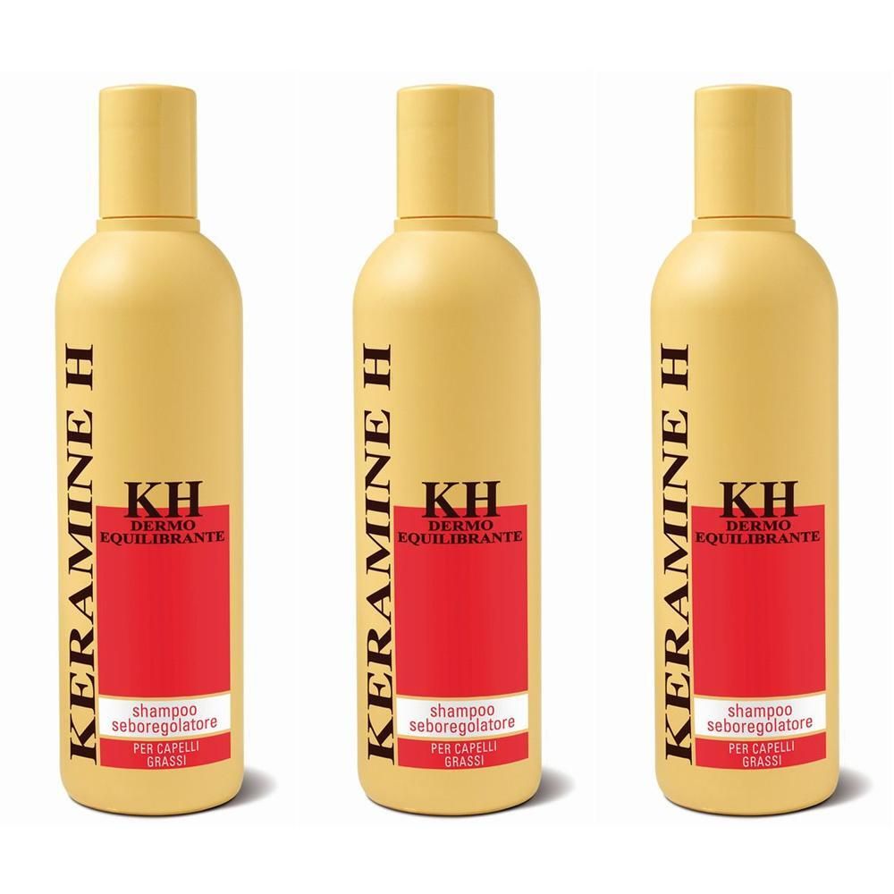 Tre flaconi gialli di shampoo Keramine H con etichetta rossa.