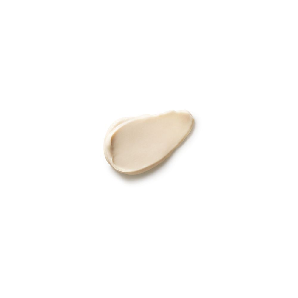 Un campione di crema deodorante per i piedi bianca su sfondo bianco.