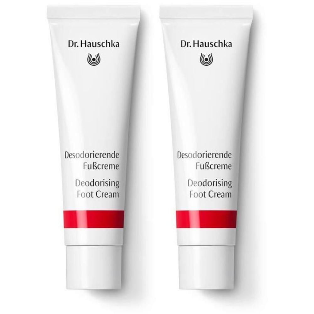 Due tubetti di crema deodorante per piedi Dr. Hauschka con banda rossa.