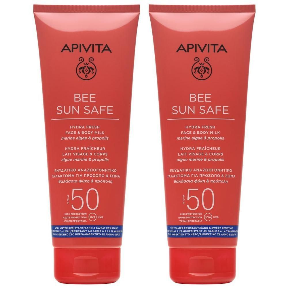 Due tubetti rossi di APIVITA Bee Sun Safe Latte Hydra Fresh Viso e Corpo SPF50.