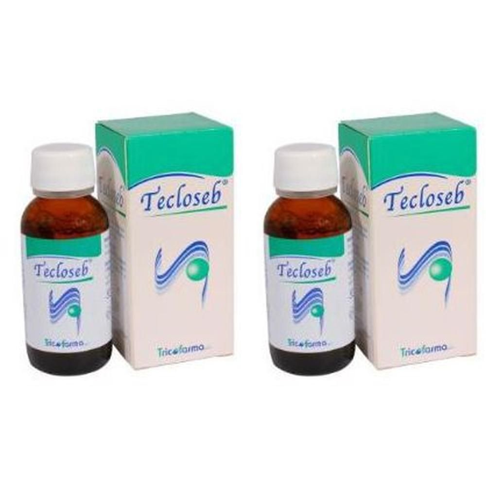 Due flaconi di Tecloseb con scatole. Liquido marrone in flaconi di vetro con tappi bianchi.
