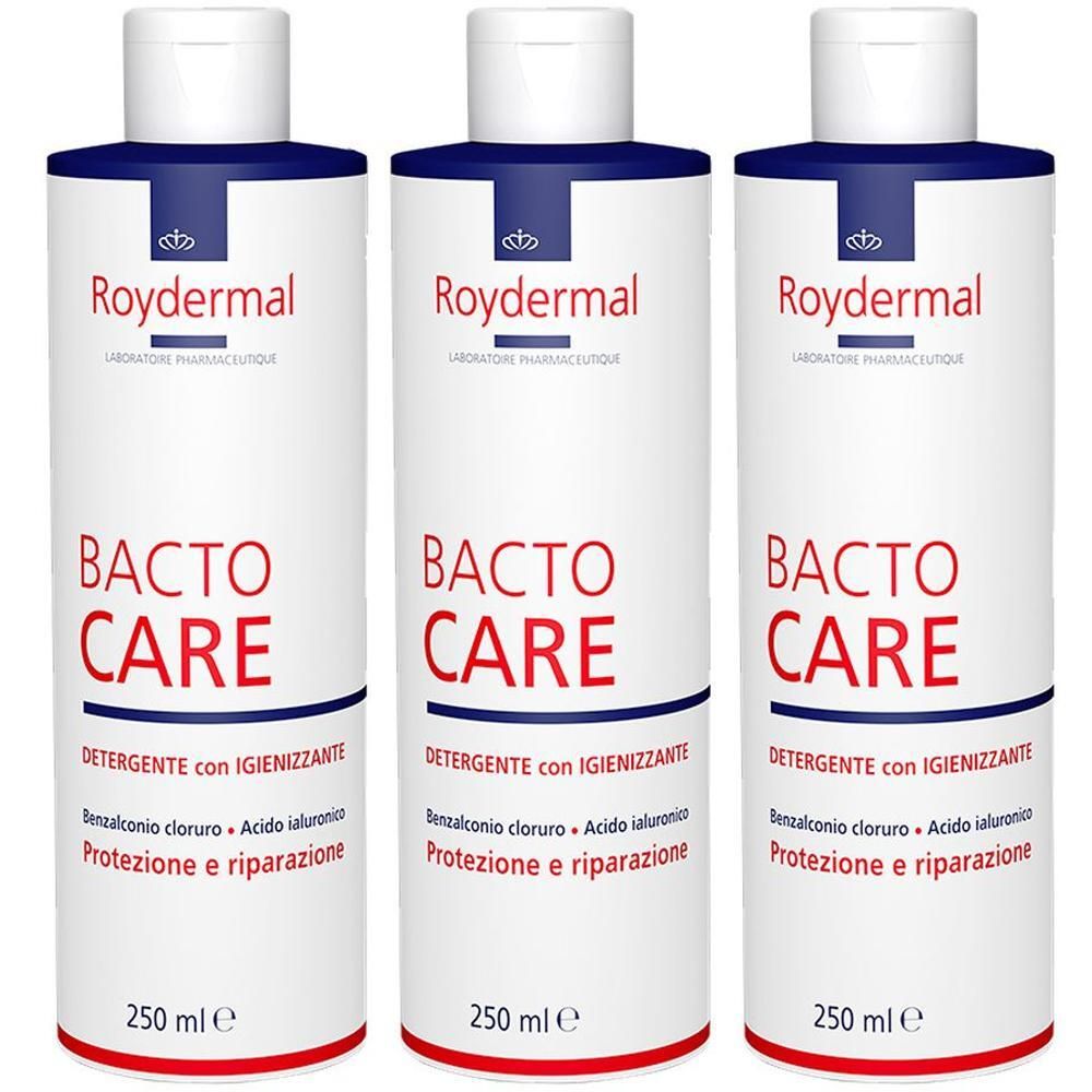 Tre flaconi bianchi con etichetta blu e rossa. Testo: Roydermal Bacto Care, 250 ml.