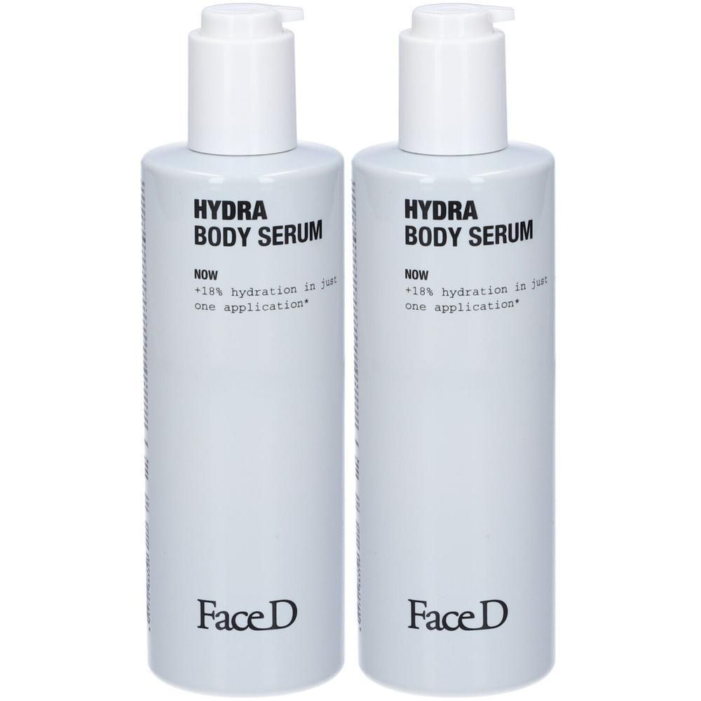 Due flaconi spray bianchi con Face D Hydra Body Serum.