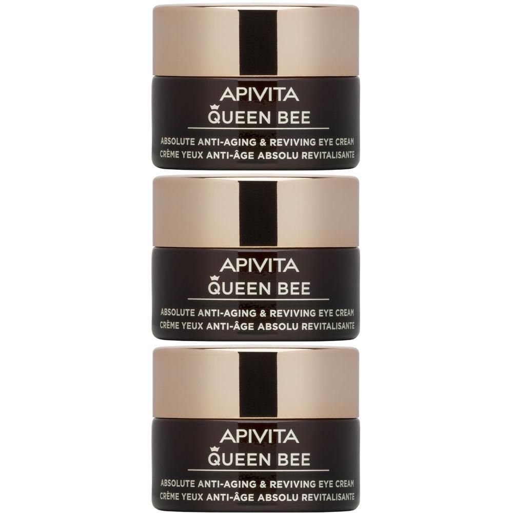 Tre barattoli di crema contorno occhi APIVITA Queen Bee impilati.