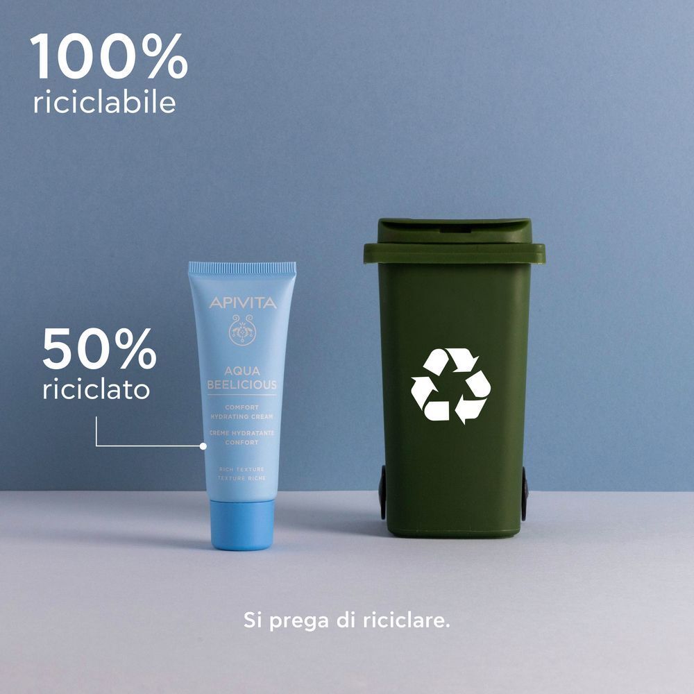Tubo APIVITA Aqua Beelicious accanto a un bidone per il riciclaggio.