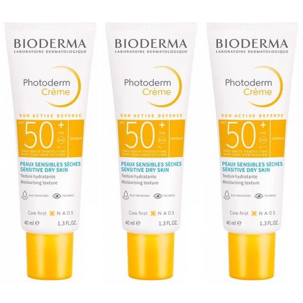 Tre tubetti di BIODERMA Photoderm Crema SPF50+ con tappi gialli. Per pelli sensibili e secche.