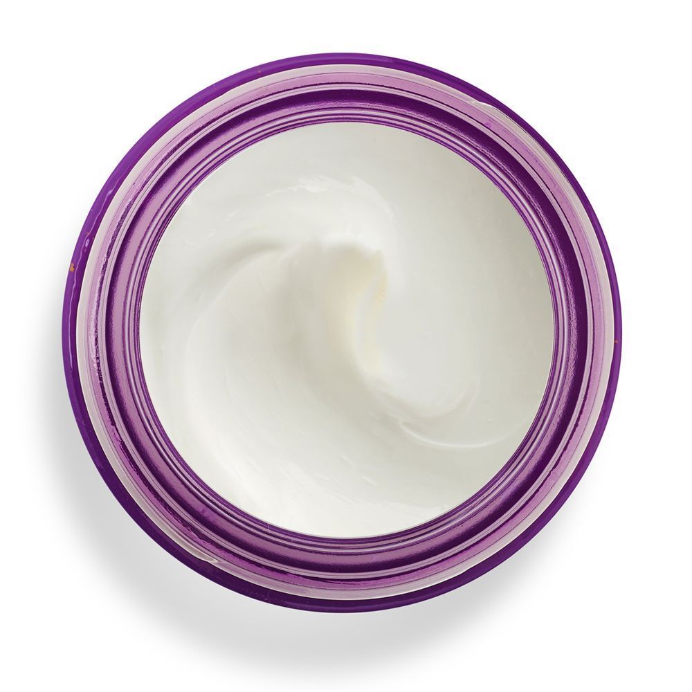 Vista dall'alto di un vasetto aperto di crema viso KORFF Lifting, riempito di crema bianca.