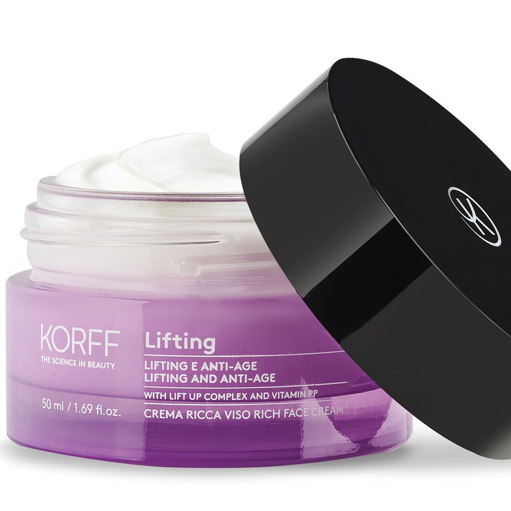 Un barattolo aperto di crema viso KORFF Lifting con crema bianca e il suo coperchio nero accanto.