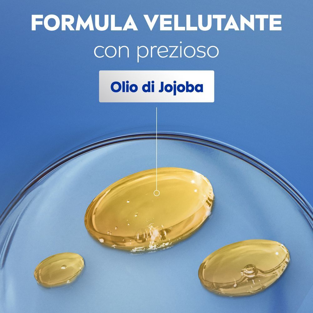 Gocce di olio di jojoba che simboleggiano la formula vellutante della crema corpo.