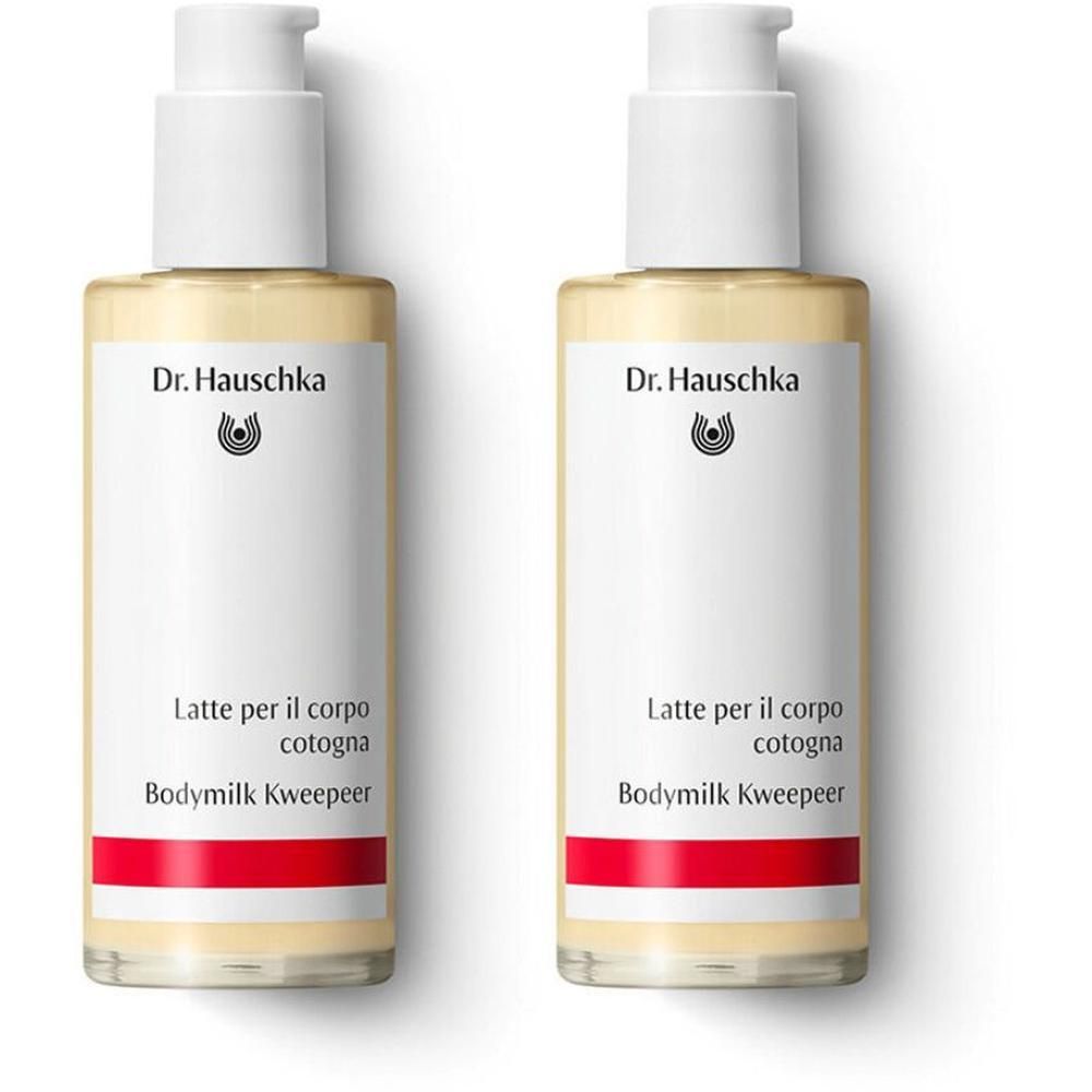 Due flaconi di Latte per il corpo Cotogna Dr. Hauschka con erogatore e fascia rossa.