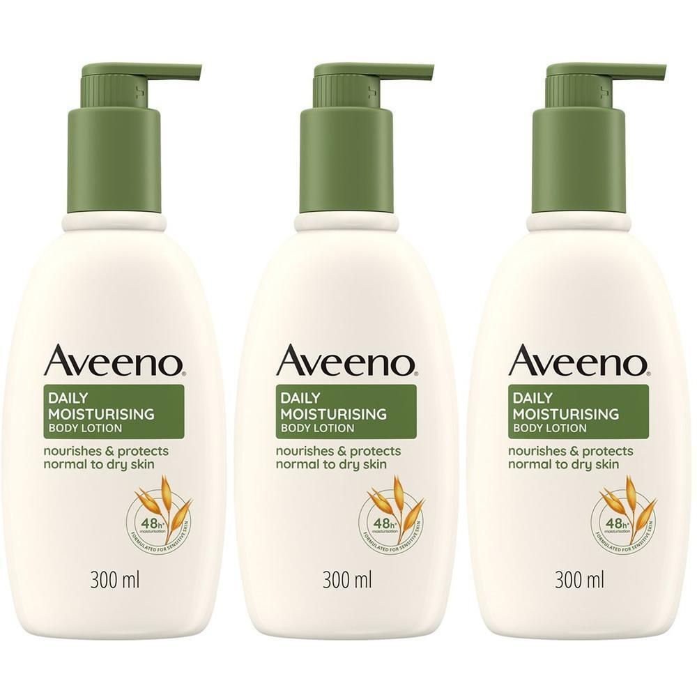 Tre flaconi di lozione corpo idratante Aveeno con dispenser a pompa.