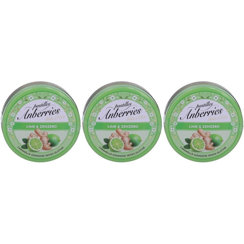 Tre scatole rotonde verdi di pastiglie Anberries al gusto lime e zenzero.