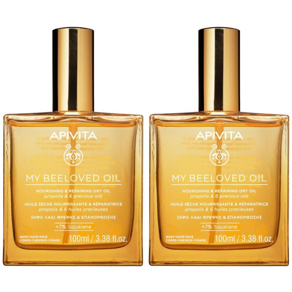 Due flaconi di APIVITA My Beeloved Oil, 100ml, con tappi dorati.