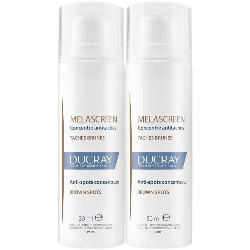 Due flaconi pompa bianchi di concentrato anti-macchie Ducray Melascreen.