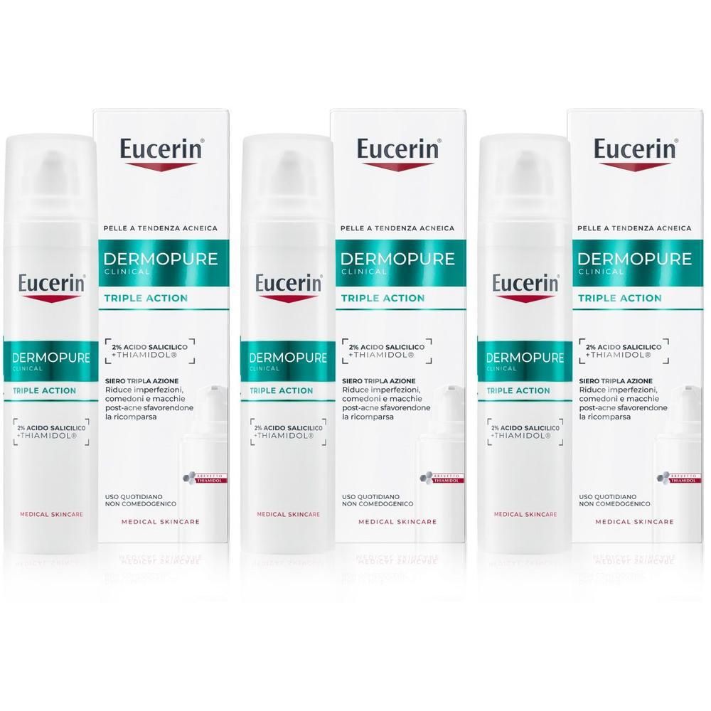 Tre flaconi di Eucerin Dermopure Clinical Siero Tripla Azione nelle loro confezioni.