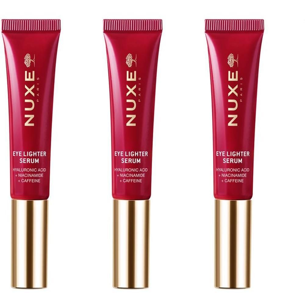 Tre tubetti rossi con tappi dorati, Nuxe Eye Lighter Serum.