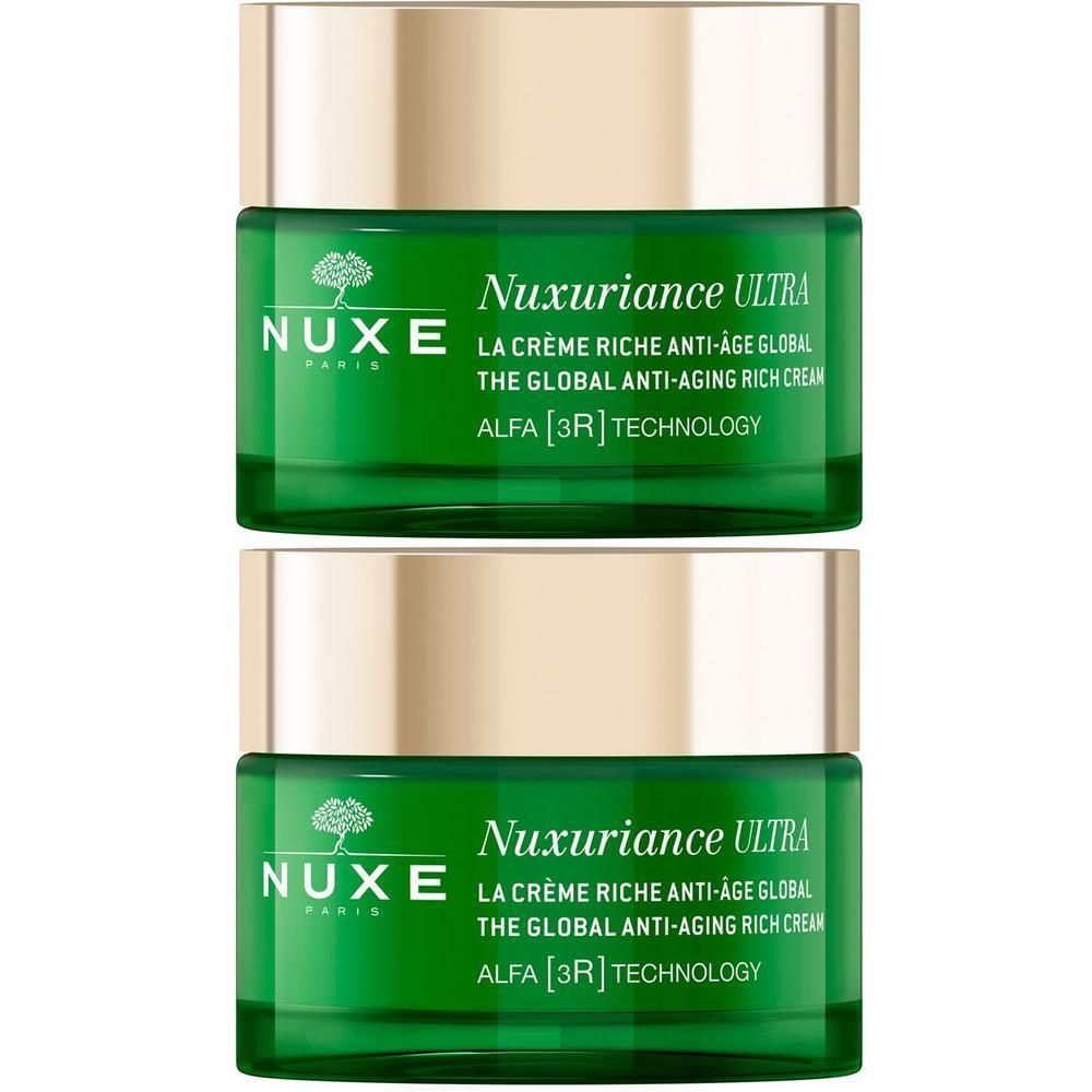 Due vasetti di crema Nuxe Nuxuriance Ultra con tappi dorati.