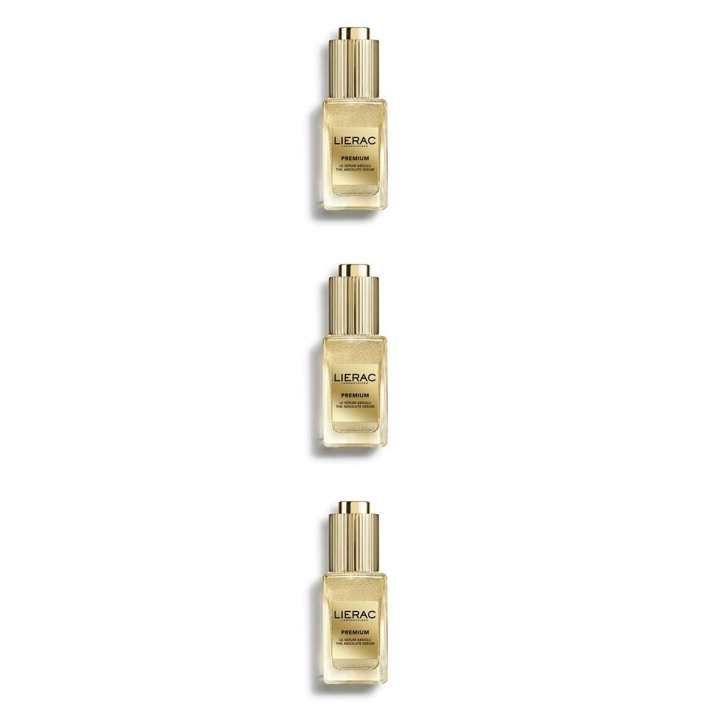 Tre flaconcini Lierac Premium con contagocce, tappo dorato.