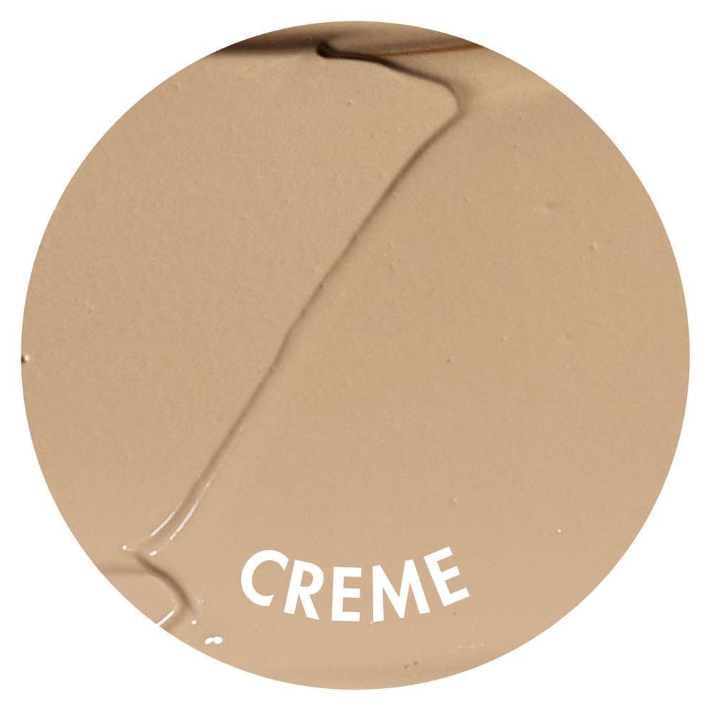 Un campione rotondo di texture color crema con la parola 'CREME'.