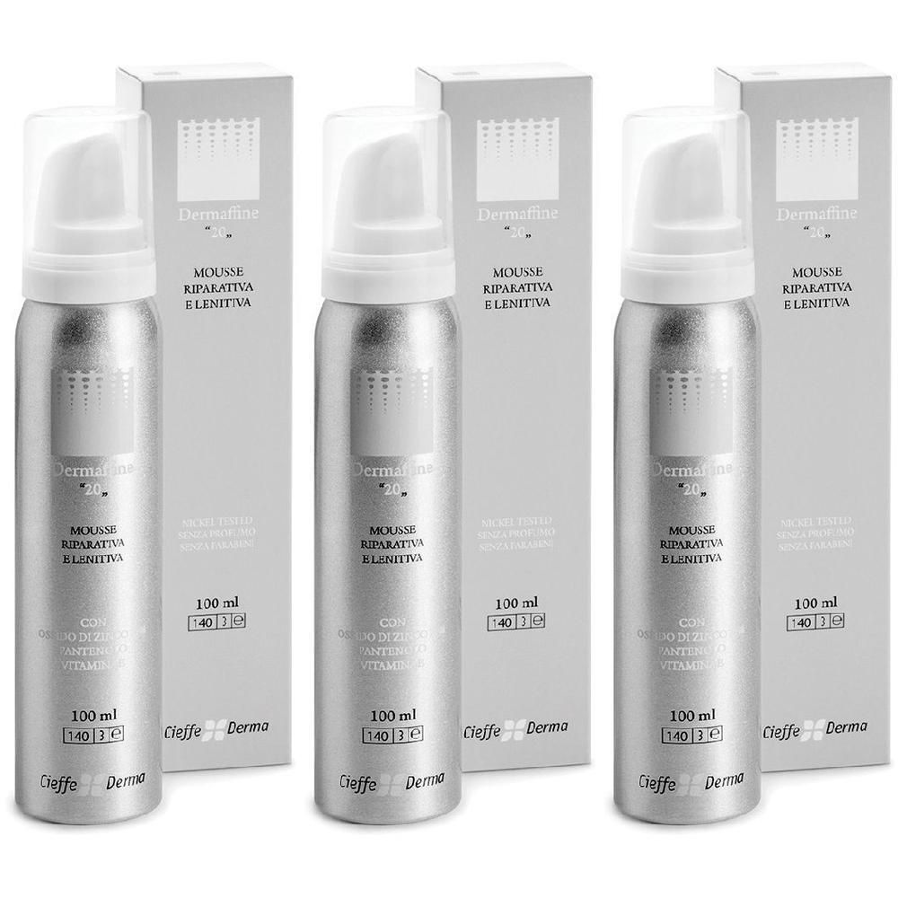 Tre flaconi spray argentati con erogatore e scatole. Etichetta: Dermaffine 20, Mousse Reparativa e Lenitiva.