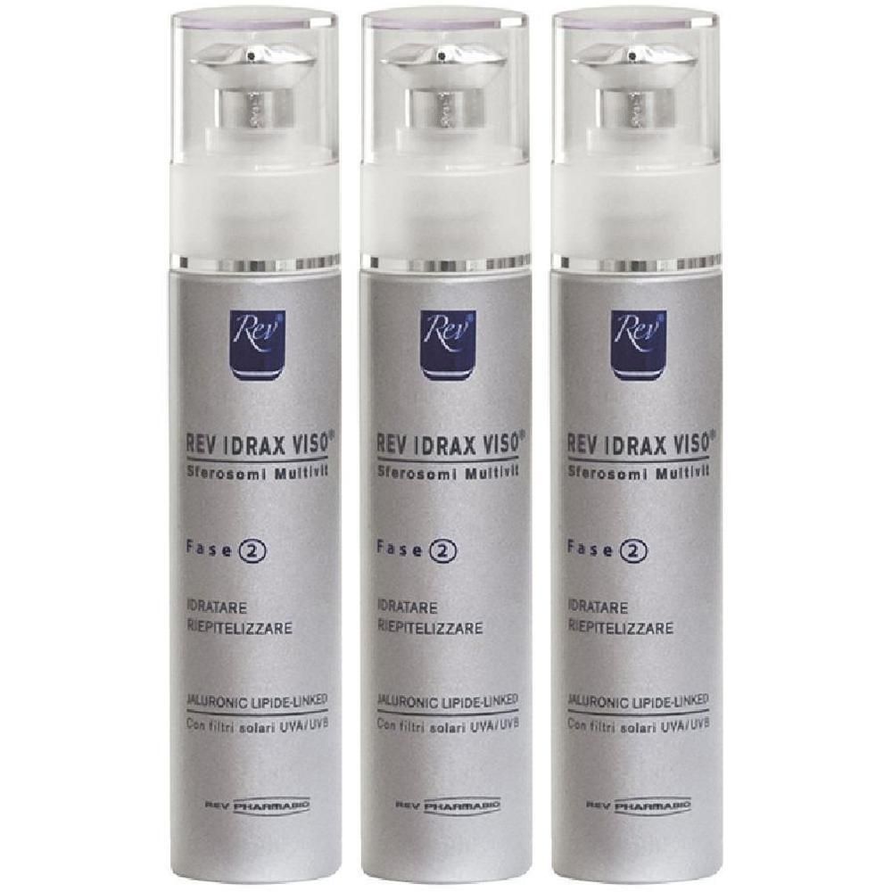 Tre flaconi spray Rev Idrax Viso con corpo argentato e beccuccio bianco. Etichettatura in tedesco e italiano.