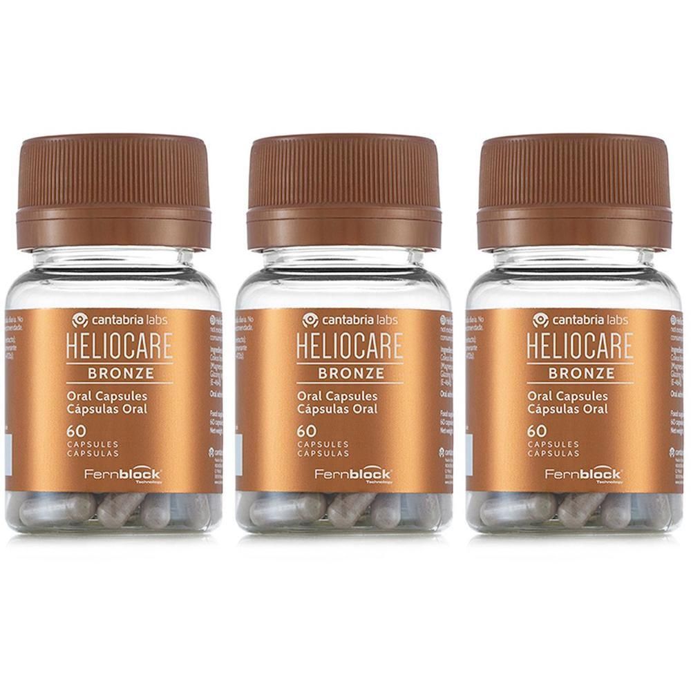 Tre flaconi di Heliocare Bronze Oral Capsules, ciascuno con 60 capsule. Capsule trasparenti in contenitori marroni con tappi marroni.